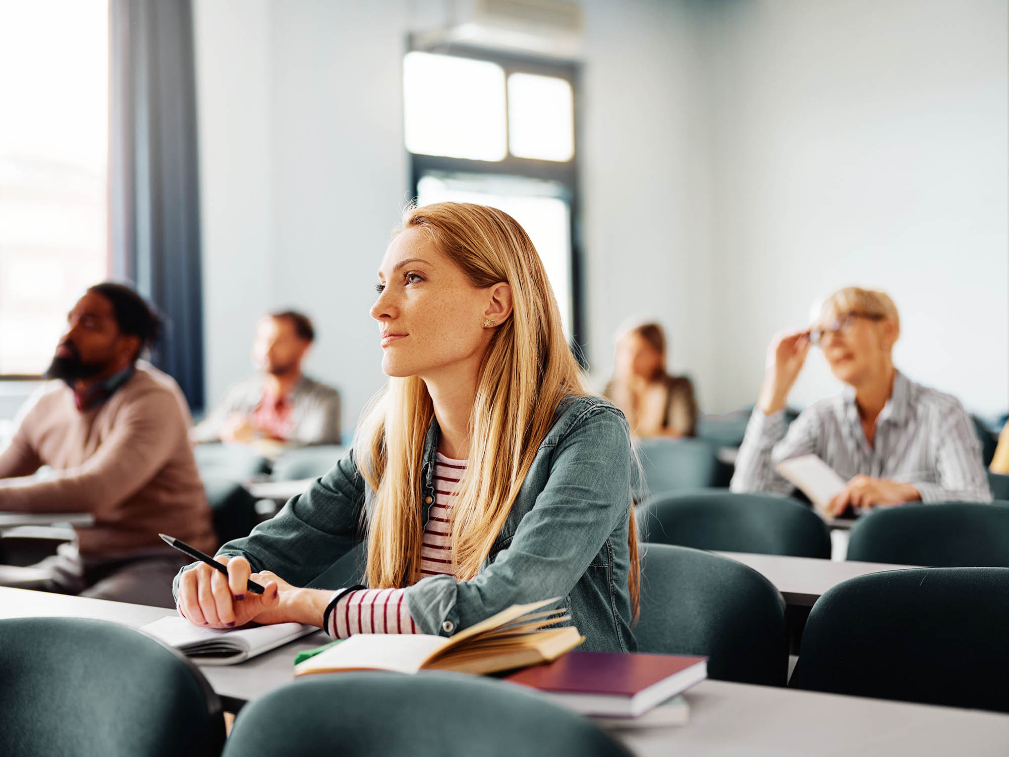 A group of adults in a seminar room